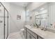 Clean bathroom with a walk-in shower and modern vanity at 20296 Bandera Pl, Venice, FL 34293