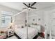 Charming bedroom with a four-poster bed and ample natural light at 20296 Bandera Pl, Venice, FL 34293