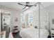 Spacious bedroom with a four-poster bed and ensuite bathroom access at 20296 Bandera Pl, Venice, FL 34293