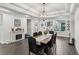 Bright dining room with wood table and chandelier at 20296 Bandera Pl, Venice, FL 34293