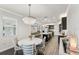 Bright dining room with kitchen and living room views at 20296 Bandera Pl, Venice, FL 34293