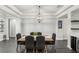Modern dining room with wood table and wine storage at 20296 Bandera Pl, Venice, FL 34293