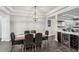 Spacious dining area with wood table and chandelier at 20296 Bandera Pl, Venice, FL 34293