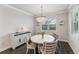 Charming dining room with round table and chandelier at 20296 Bandera Pl, Venice, FL 34293