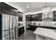 Modern kitchen with stainless steel appliances and ample counter space at 20296 Bandera Pl, Venice, FL 34293
