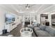 Open living room with hardwood floors and kitchen views at 20296 Bandera Pl, Venice, FL 34293
