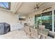 Outdoor kitchen with seating area and large TV at 20296 Bandera Pl, Venice, FL 34293