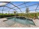Enclosed pool and spa with ample lounge space at 20296 Bandera Pl, Venice, FL 34293