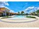Relaxing resort-style pool with lounge chairs and palm trees at 20296 Bandera Pl, Venice, FL 34293