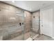 Large walk-in shower with tile surround and built-in seat at 20296 Bandera Pl, Venice, FL 34293
