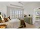 Bedroom with green dresser and view of patio at 209 Fontanelle Cir, Venice, FL 34292