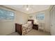 Small bedroom with twin bed, window shutters, and neutral decor at 2264 Floyd St, Sarasota, FL 34239