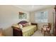 Bedroom with daybed, window shutters, and neutral decor at 2264 Floyd St, Sarasota, FL 34239