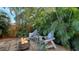 Relaxing fire pit area surrounded by lush tropical plants at 2264 Floyd St, Sarasota, FL 34239