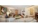 Bright living room with comfy sofas, built-in shelving, and hardwood floors at 2264 Floyd St, Sarasota, FL 34239
