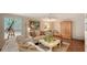 Relaxing living room with light colored sofa and hardwood floors at 2264 Floyd St, Sarasota, FL 34239