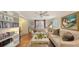 Living room with hardwood floors, built-in shelves, and access to backyard at 2264 Floyd St, Sarasota, FL 34239