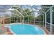 Inviting kidney-shaped pool in a screened enclosure at 2264 Floyd St, Sarasota, FL 34239