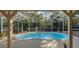 Inviting kidney-shaped pool in a screened enclosure at 2264 Floyd St, Sarasota, FL 34239