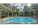 Inviting kidney-shaped pool in a screened enclosure at 2264 Floyd St, Sarasota, FL 34239