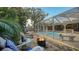 View of the pool and patio with fire pit at 2264 Floyd St, Sarasota, FL 34239
