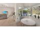 Bright breakfast nook with pool view and access to the living room at 25072 Palisade Rd, Punta Gorda, FL 33983