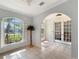 Light-filled entryway with tile floors and French doors at 25072 Palisade Rd, Punta Gorda, FL 33983