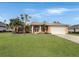 Beautiful home with a 2 car garage and well-manicured lawn at 25072 Palisade Rd, Punta Gorda, FL 33983