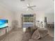 Spacious living area with access to the pool and patio at 25072 Palisade Rd, Punta Gorda, FL 33983