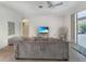 Relaxing living room featuring a large TV and comfortable seating at 25072 Palisade Rd, Punta Gorda, FL 33983