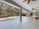 Inviting pool area with covered patio, and lush landscaping at 25072 Palisade Rd, Punta Gorda, FL 33983