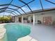 Relaxing pool and patio area with covered lanai at 25072 Palisade Rd, Punta Gorda, FL 33983