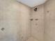 Clean shower with tiled walls and a built-in shelf at 25072 Palisade Rd, Punta Gorda, FL 33983