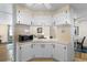 White cabinets and a built-in microwave highlight this kitchen's clean design at 312 Tropic Dr, Osprey, FL 34229