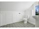Small bathroom with patterned floor and updated toilet at 320 29Th Nw St, Bradenton, FL 34205