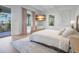Spacious bedroom with hardwood floors and access to balcony at 320 29Th Nw St, Bradenton, FL 34205