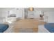 Large bedroom with two beds, hardwood floors, and workspace at 320 29Th Nw St, Bradenton, FL 34205