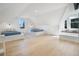 Spacious bedroom with two twin beds, hardwood floors, and window seats at 320 29Th Nw St, Bradenton, FL 34205