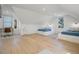 Bright bedroom with two twin beds, a desk, and hardwood floors at 320 29Th Nw St, Bradenton, FL 34205