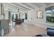 Bright dining room featuring a round table, grey chairs, and terrazzo flooring at 320 29Th Nw St, Bradenton, FL 34205