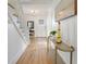 Long entry hall with hardwood floors and white wainscoting at 320 29Th Nw St, Bradenton, FL 34205