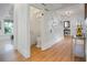 Front entry with hardwood floors, a hidden toilet, and staircase at 320 29Th Nw St, Bradenton, FL 34205