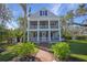 Two-story house with wrap-around porch and landscaped lawn at 320 29Th Nw St, Bradenton, FL 34205