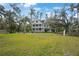 Two-story house with wrap-around porch and expansive lawn at 320 29Th Nw St, Bradenton, FL 34205