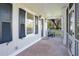 Inviting front porch with brick flooring and a screened enclosure at 320 29Th Nw St, Bradenton, FL 34205