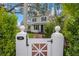 Charming home with a white picket fence and brick pathway at 320 29Th Nw St, Bradenton, FL 34205