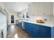 Modern kitchen with blue cabinets, stainless steel appliances, and a spacious layout at 320 29Th Nw St, Bradenton, FL 34205