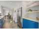 Modern kitchen with blue shaker cabinets, stainless steel appliances, and white quartz countertops at 320 29Th Nw St, Bradenton, FL 34205