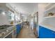 Modern kitchen with blue shaker cabinets, stainless steel appliances, and white quartz countertops at 320 29Th Nw St, Bradenton, FL 34205
