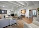 Large living area with hardwood floors, comfortable seating, and high ceilings at 320 29Th Nw St, Bradenton, FL 34205